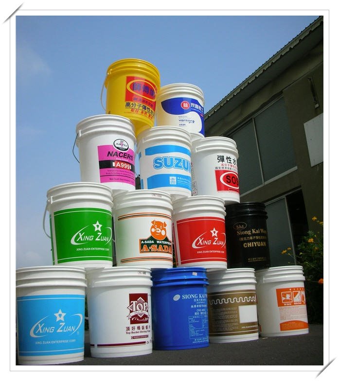 Stacked plastic buckets of paint