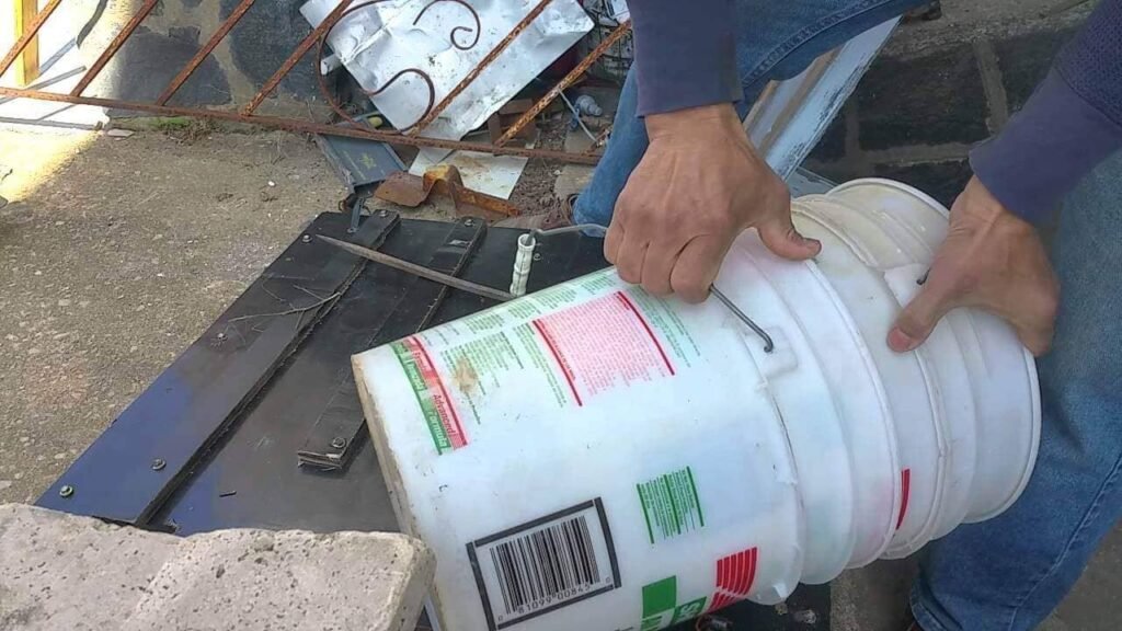 Use brute force to separate plastic buckets that are sucked together