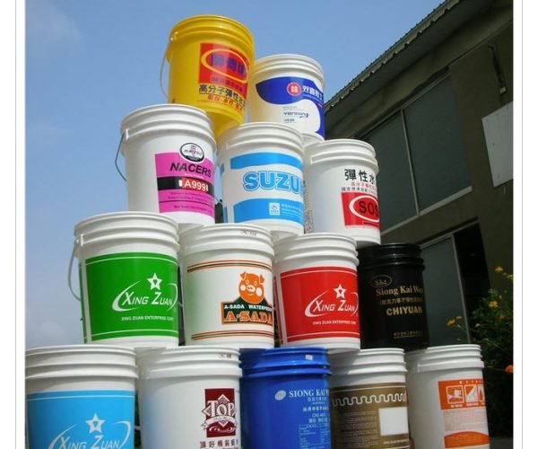 Stacked plastic buckets of paint
